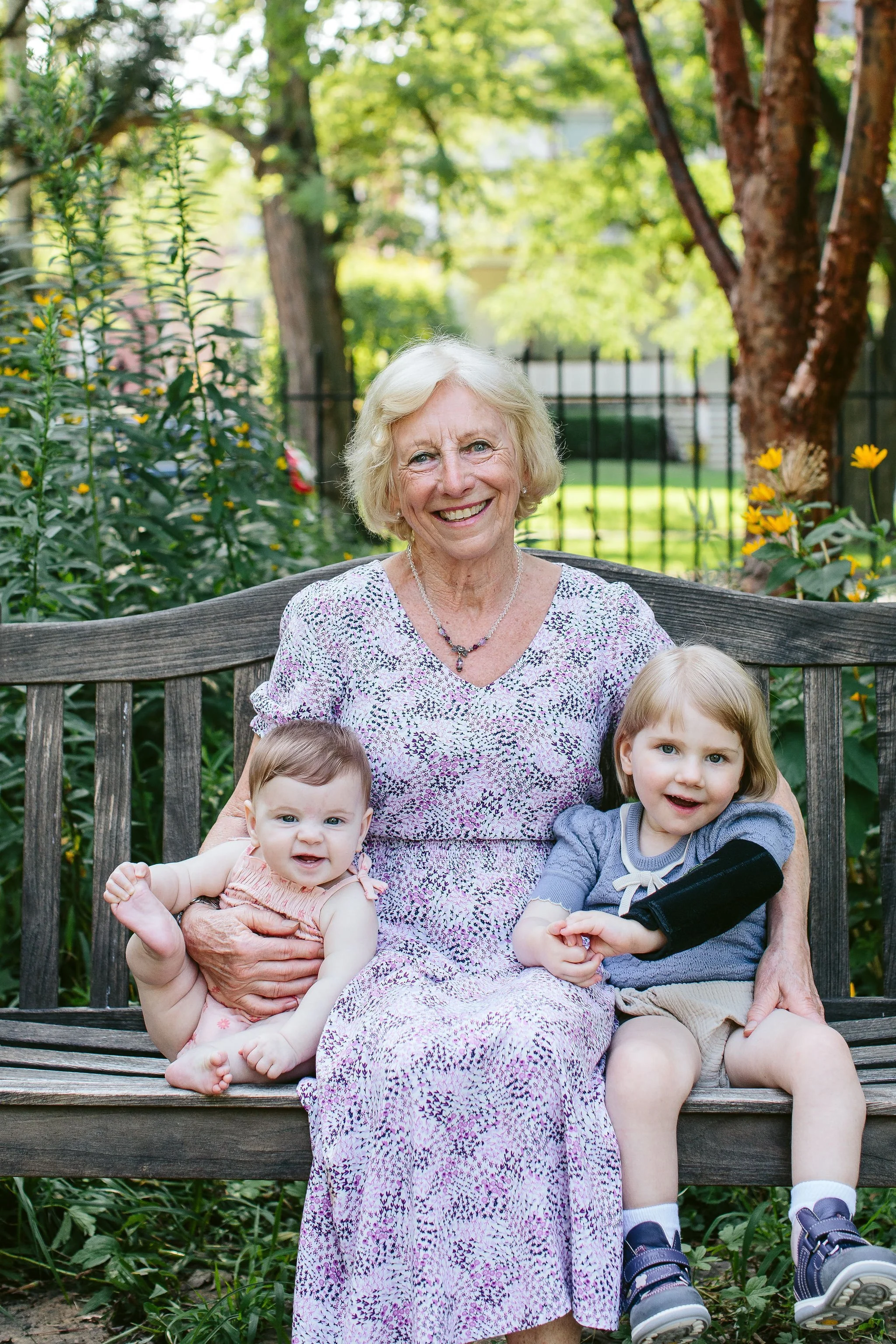 grandma poses for a portrait with her two grandkids at Cheney Mansion