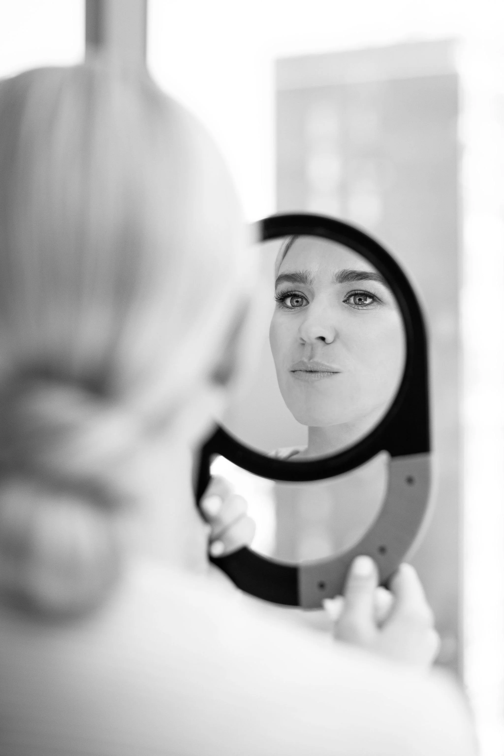 bride looking in mirror