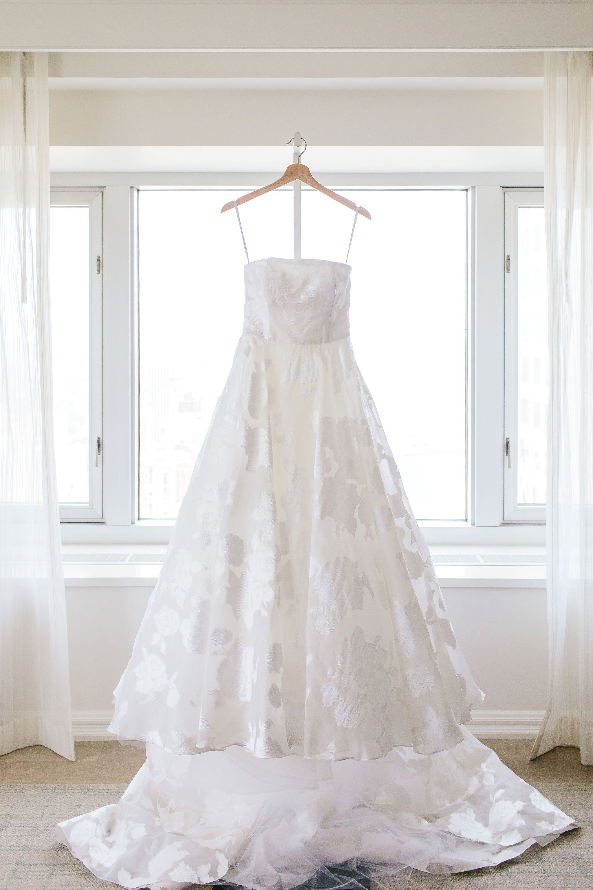 wedding dress hanging up in family home