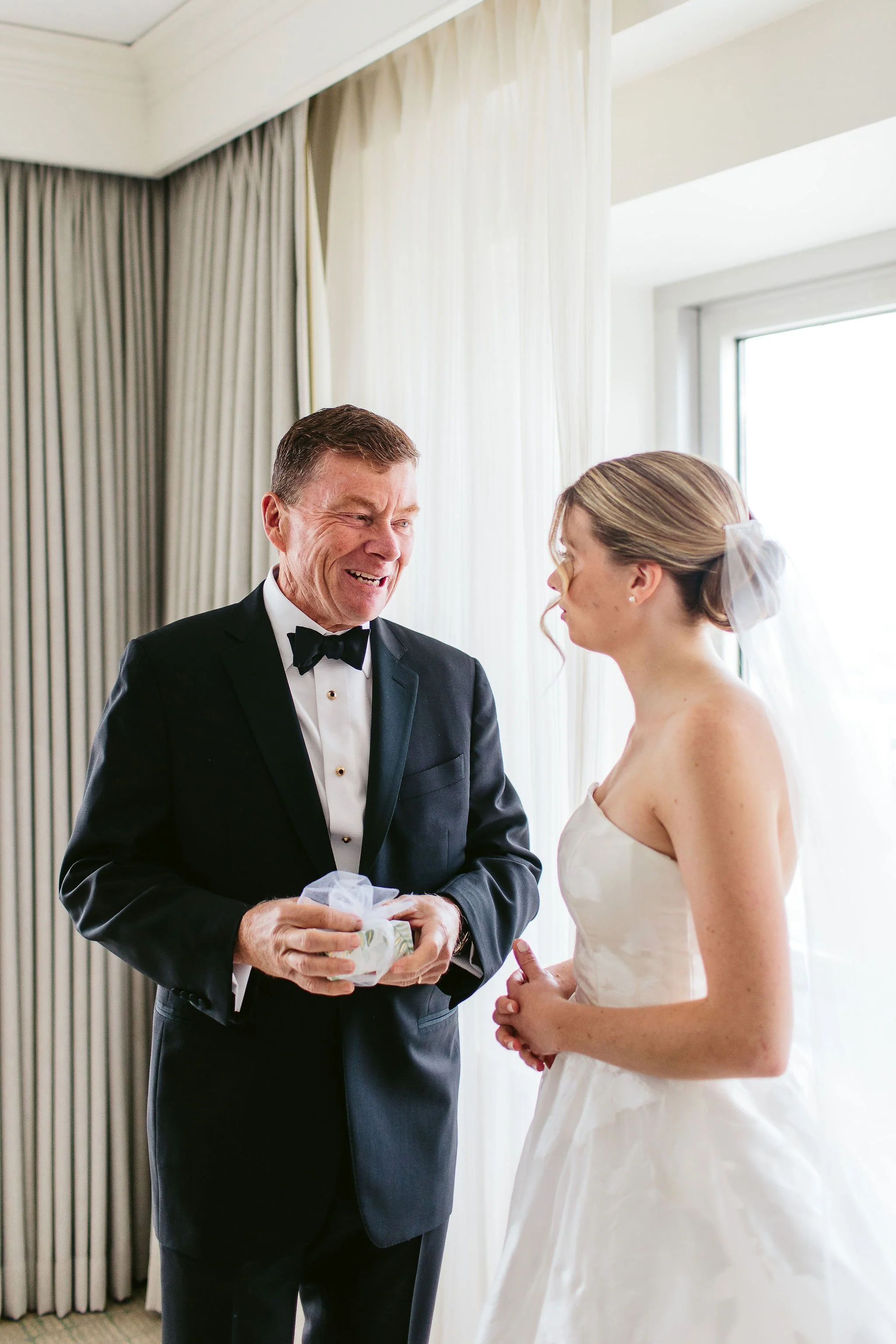bride first look with father