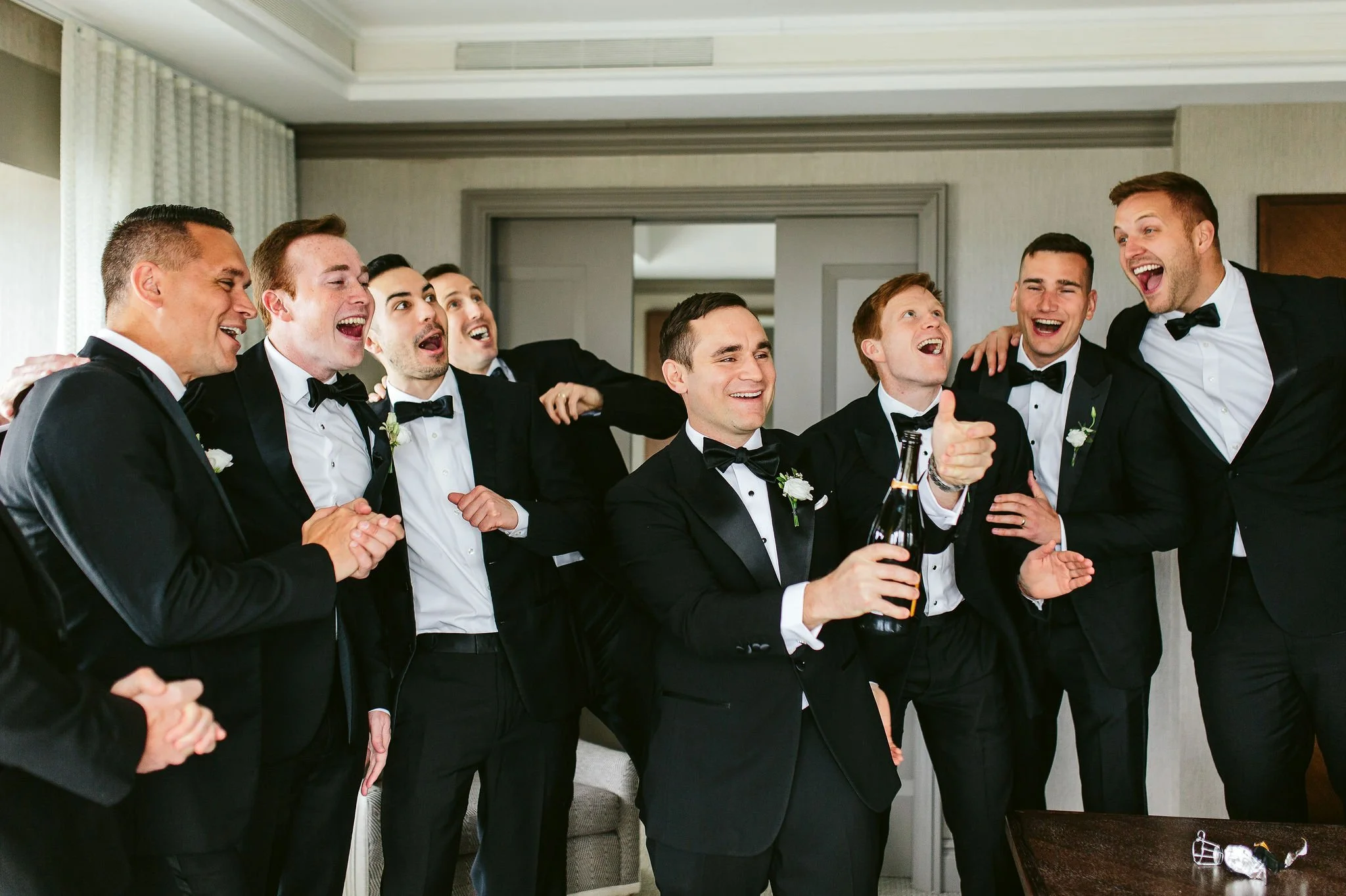 groom and groomsmen getting ready at chicago wedding