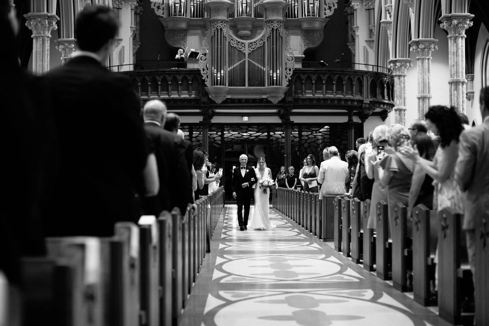 bride and father processing at church wedding