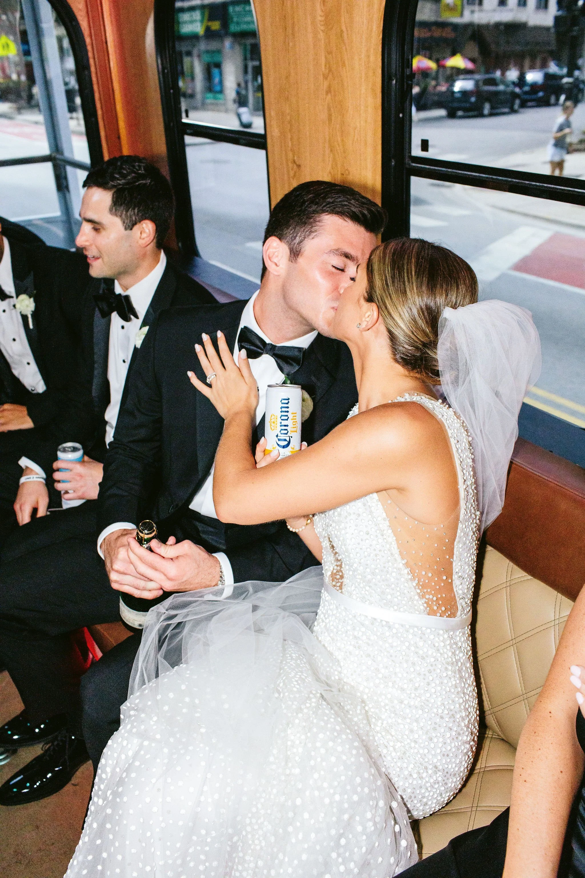 bride and groom on wedding bus