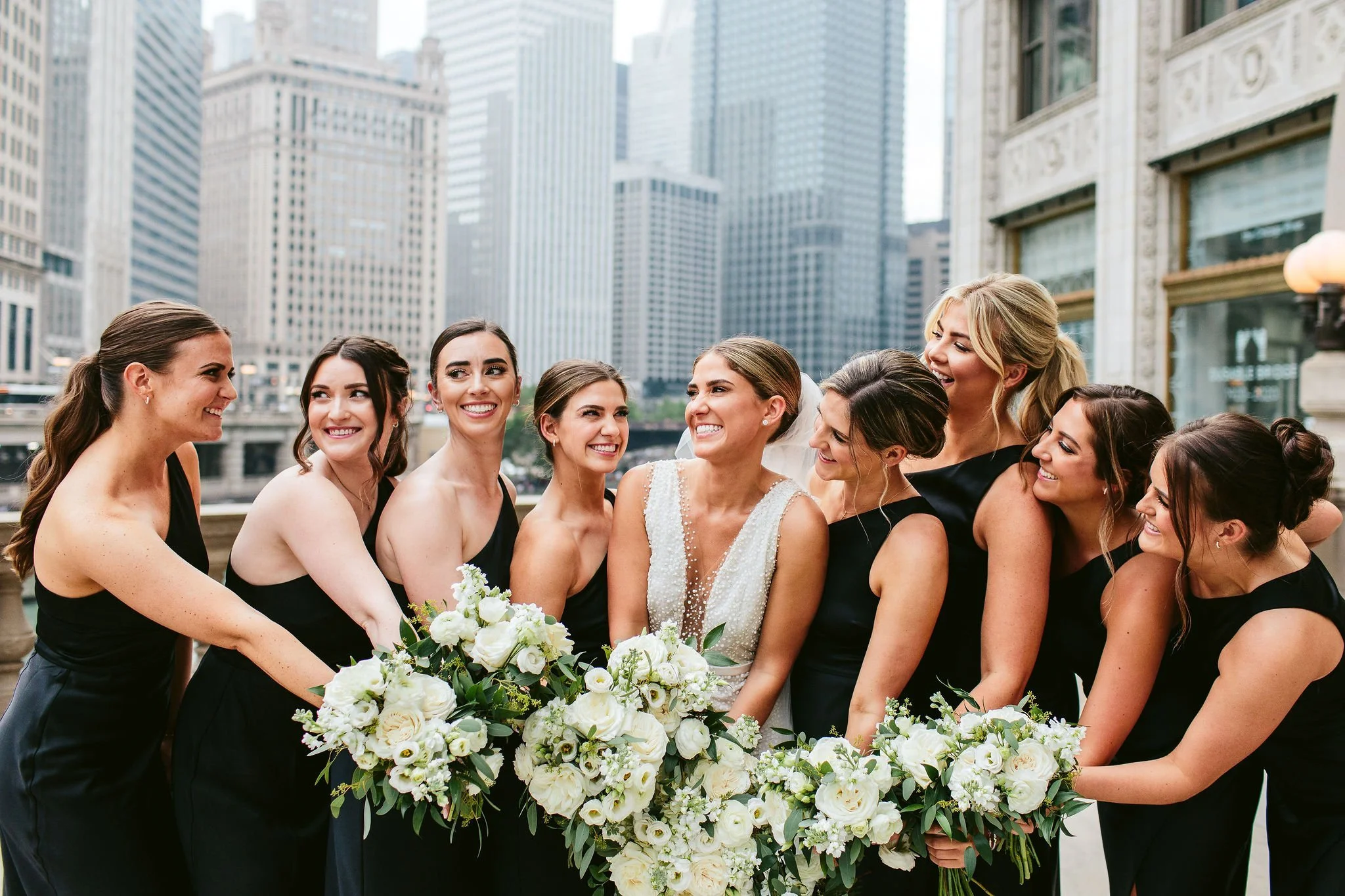 bridesmaids with white bouquets