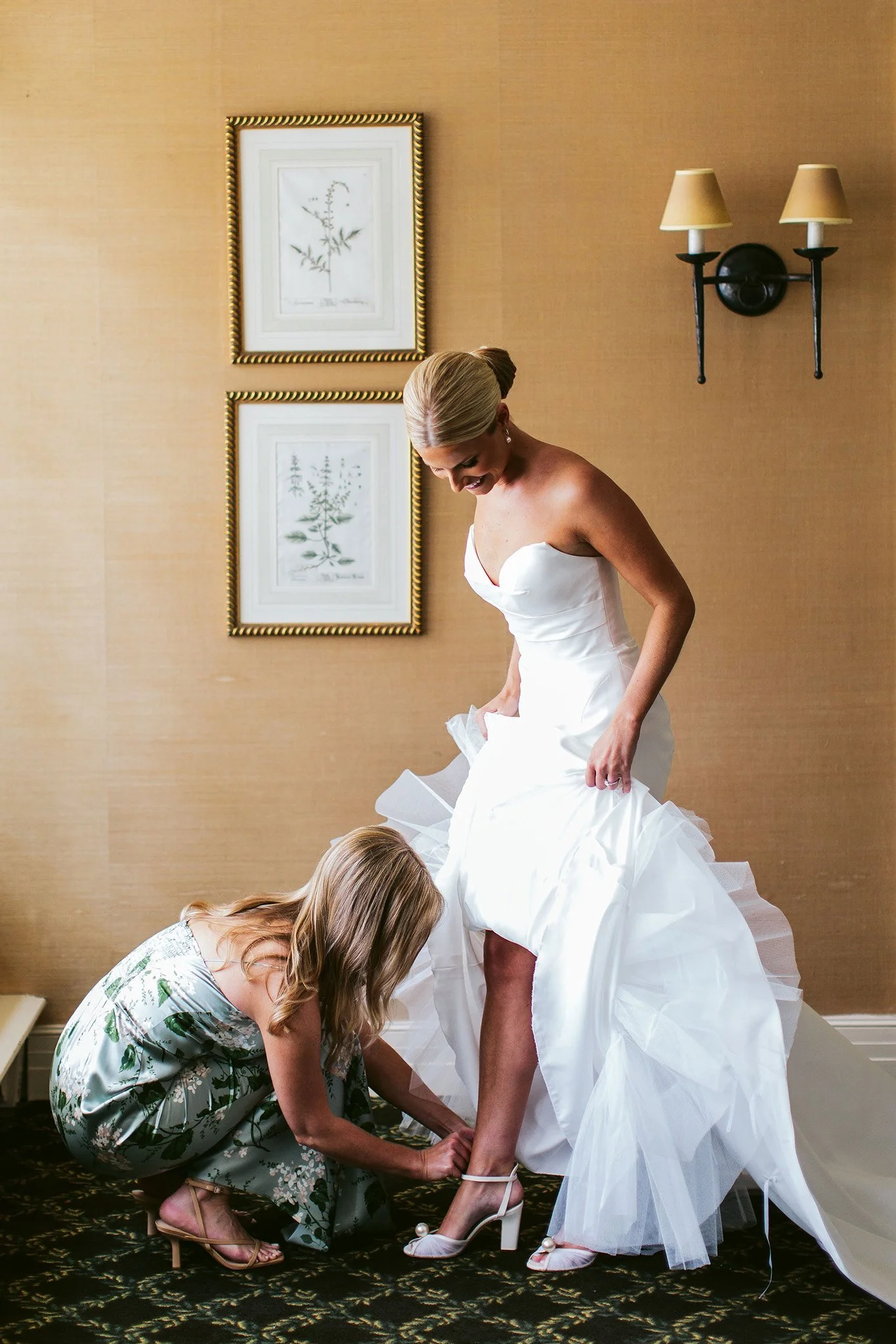 bride putting on shoes at saddle &amp; cycle club