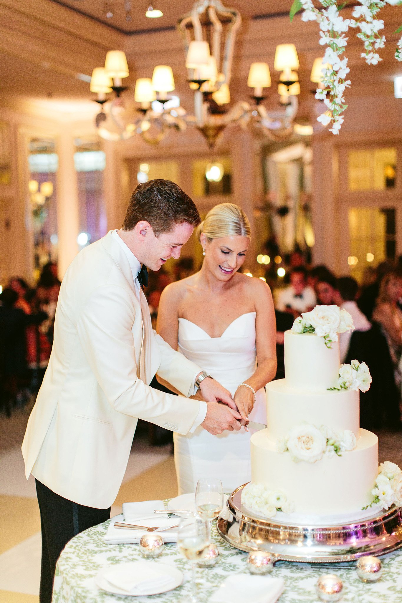 cutting the cake at saddle &amp; cycle club wedding