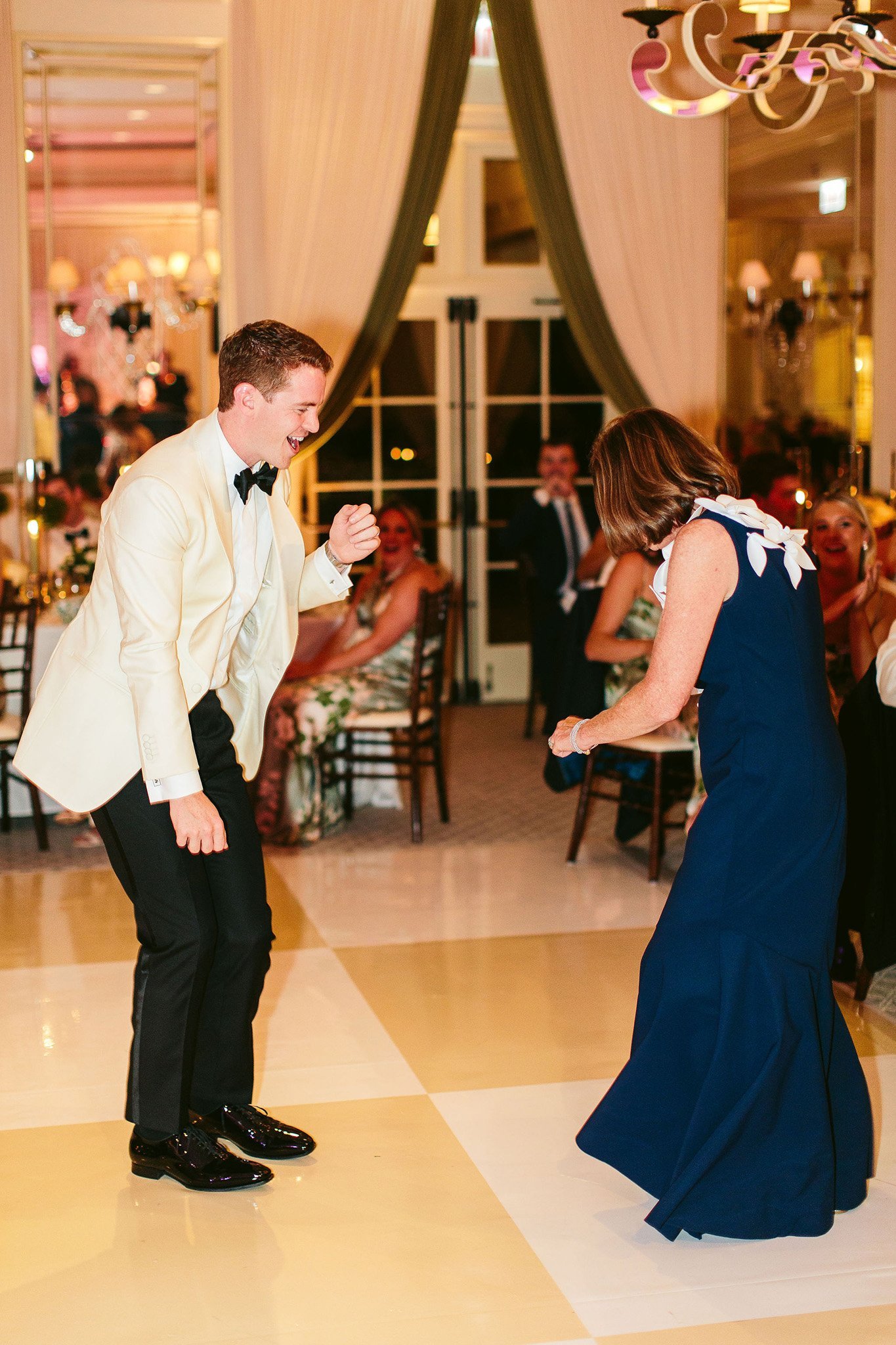 mother and son dance at saddle &amp; cycle club