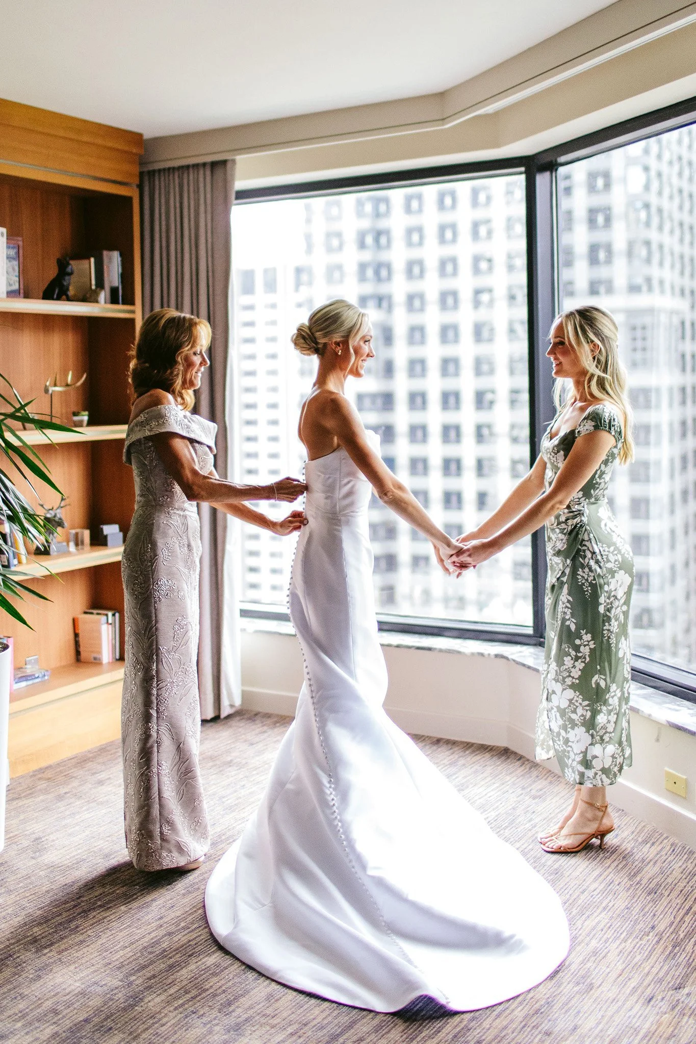 bride getting dressed on wedding day