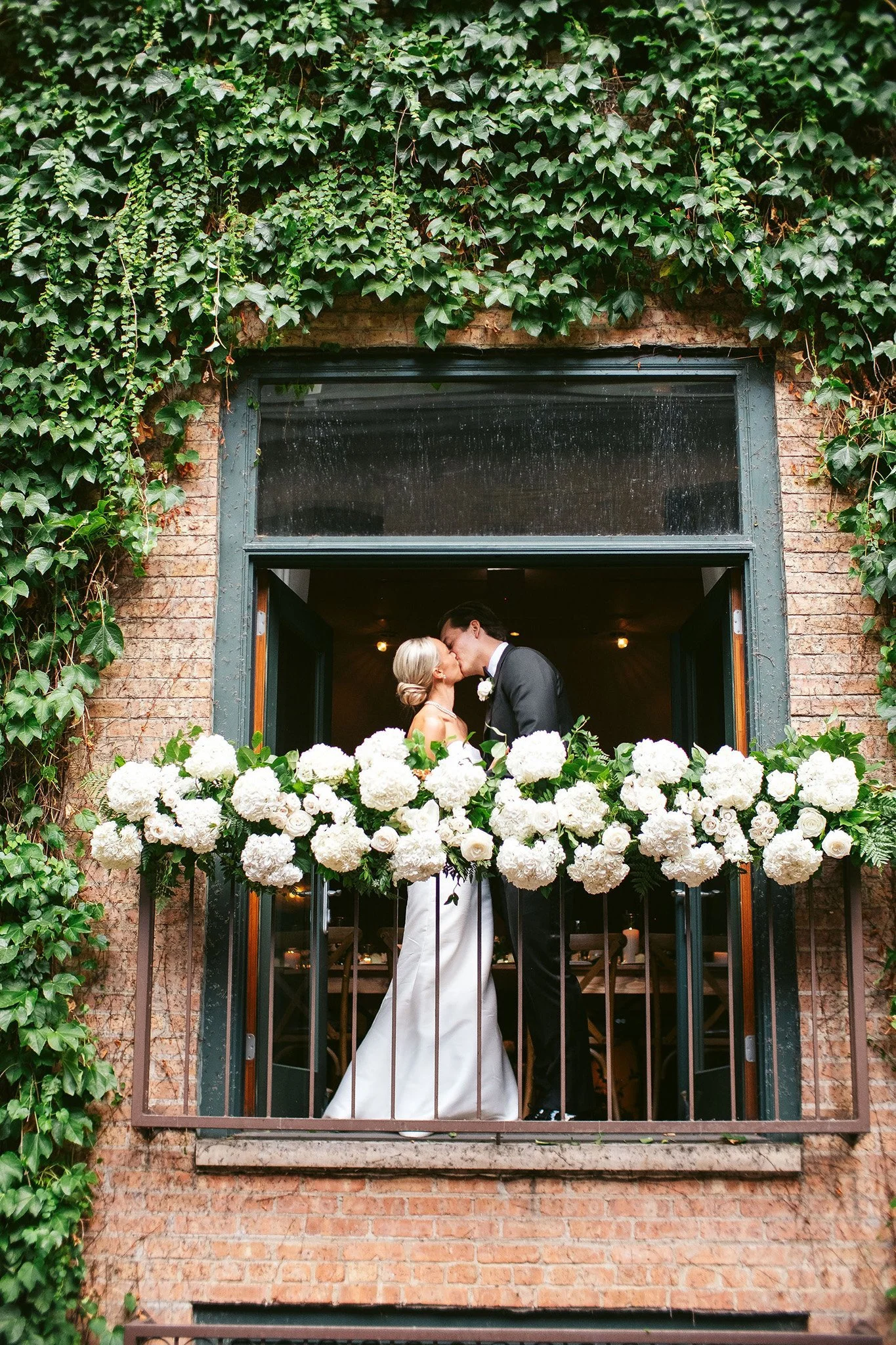 bride and groom on balcony at ivy room