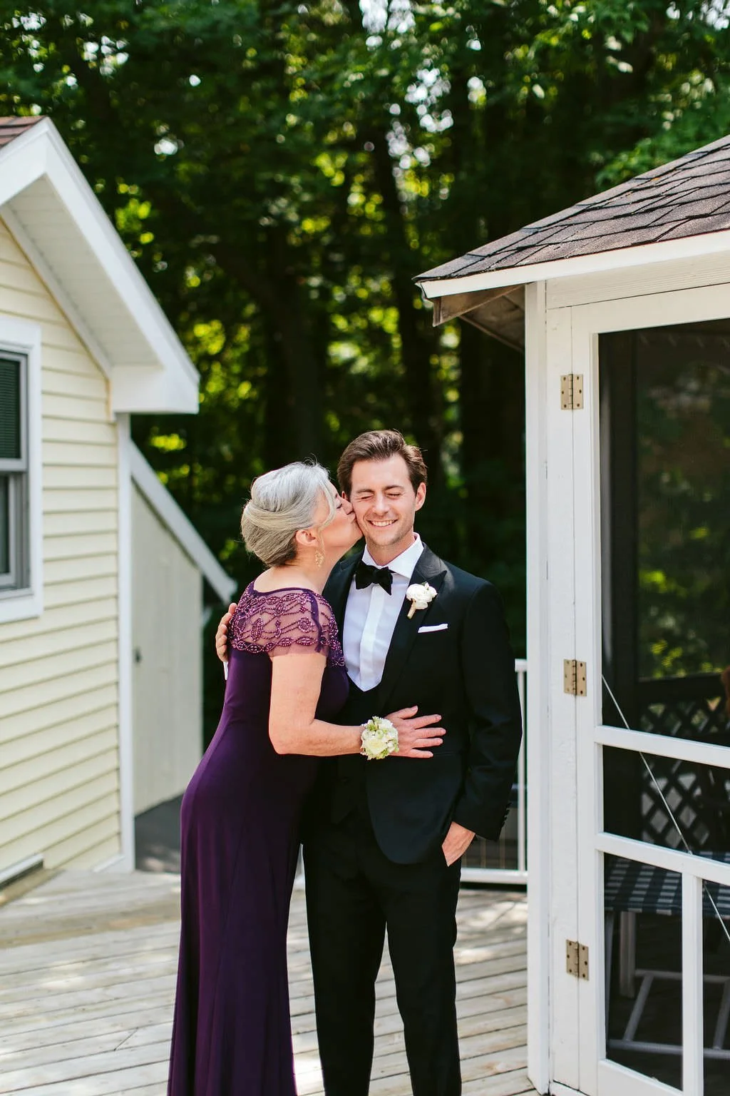 candid mother and groom portrait