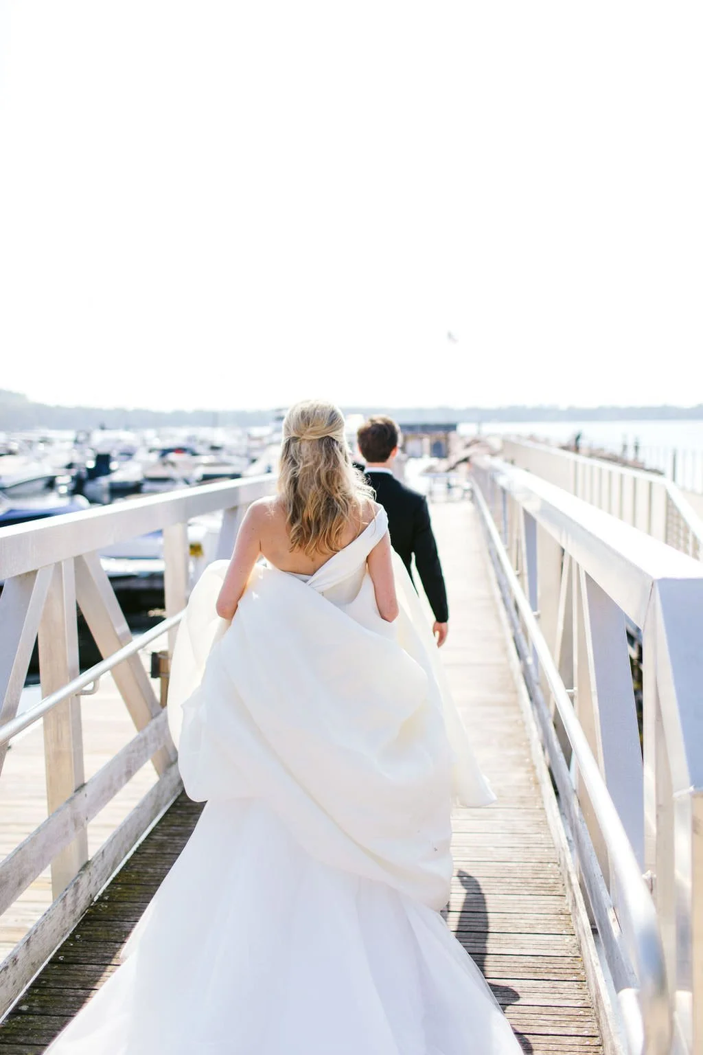 bride and groom on a dock