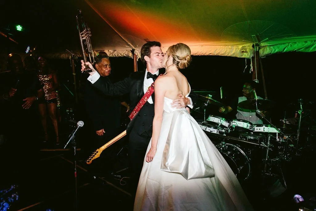 bride and groom with band
