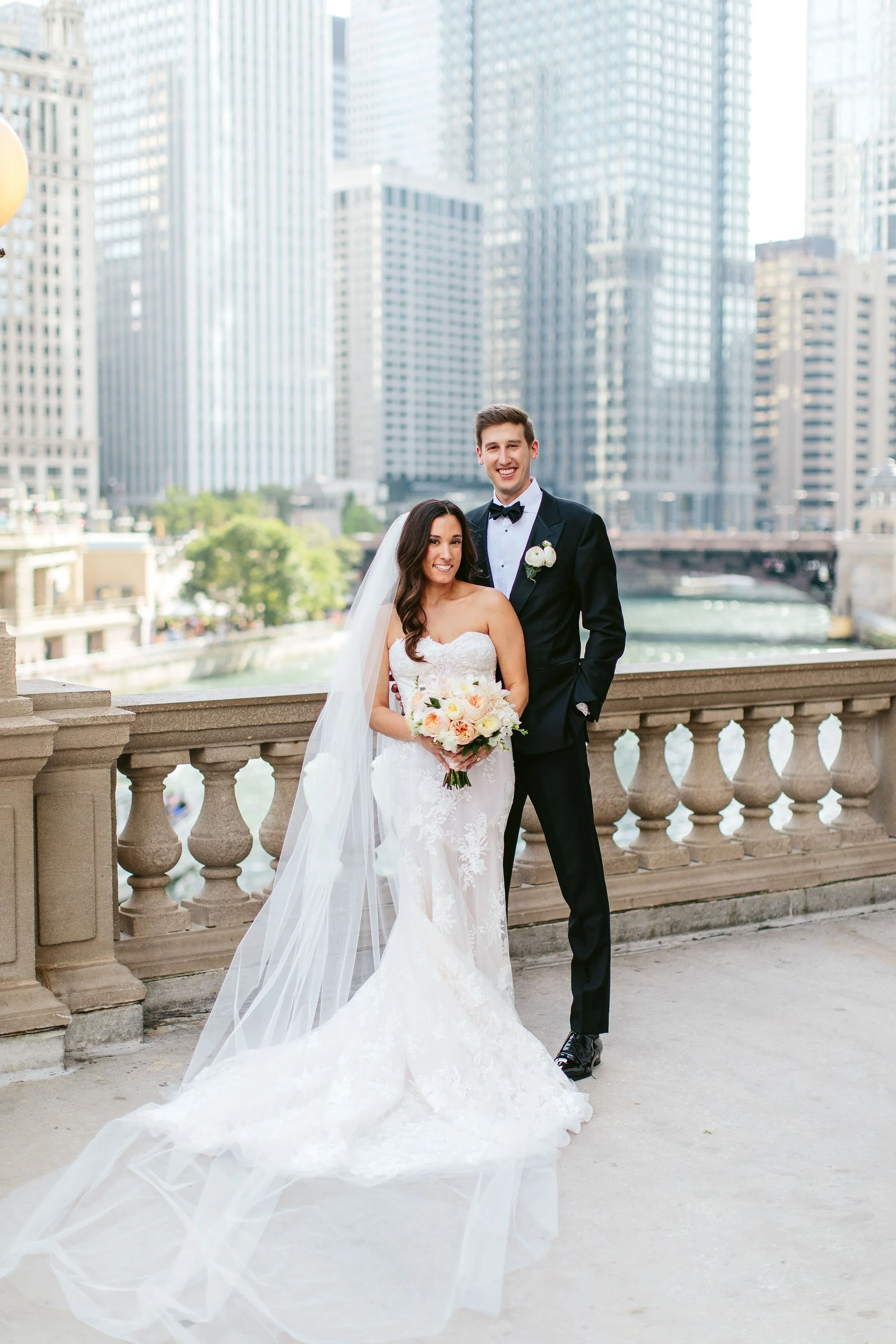 bride and groom at wrigley building