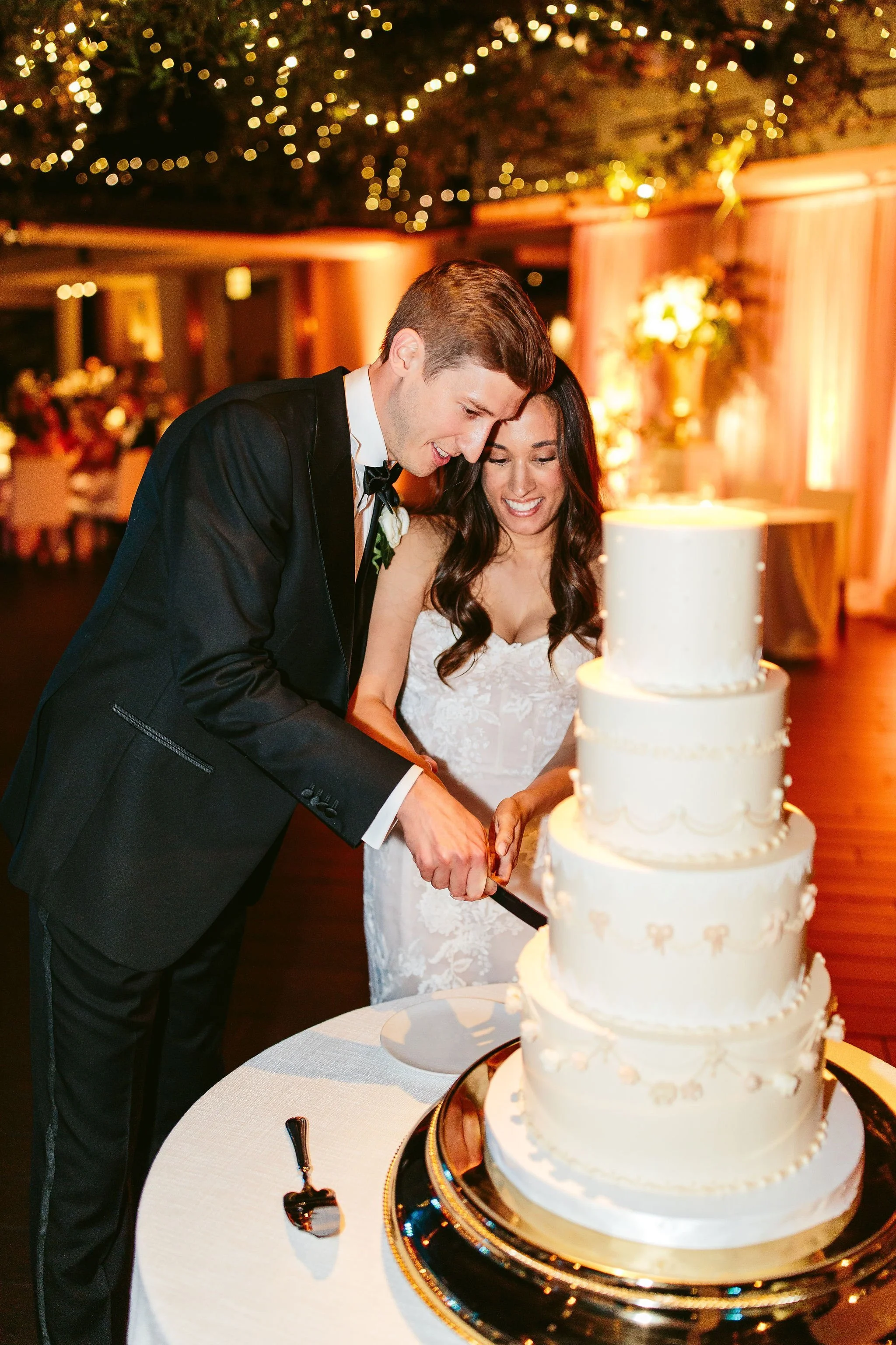 bride and groom cutting cake at chicago wedding