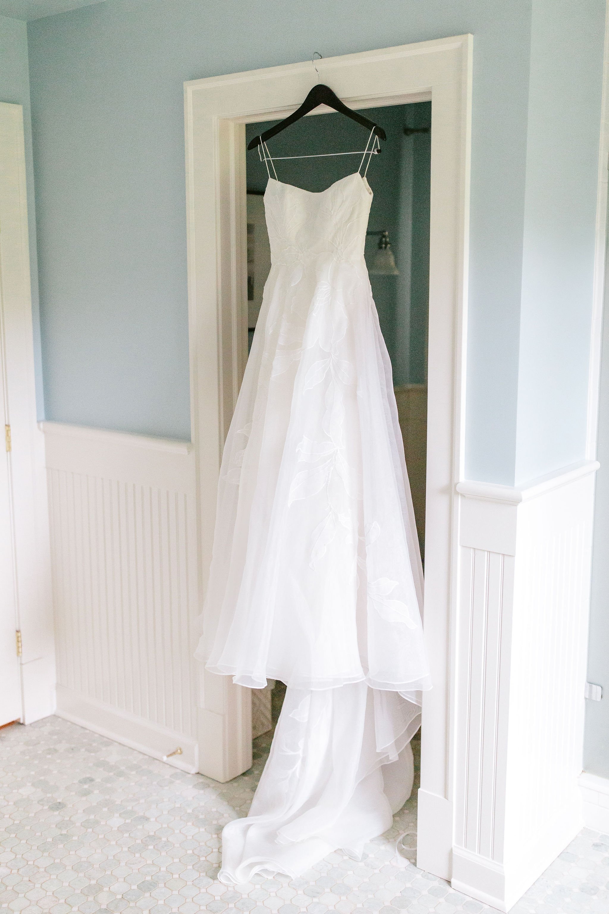 wedding dress hanging at home