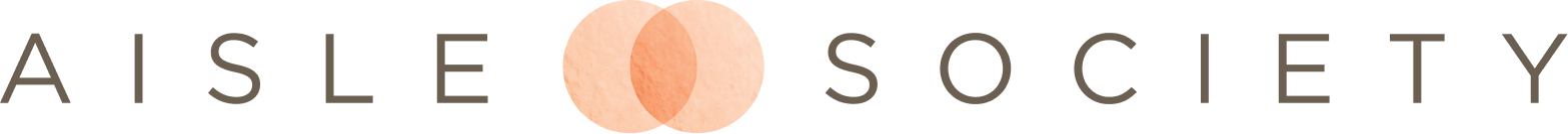 Close-up of a person holding a pregnancy test with two pink lines indicating a positive result.