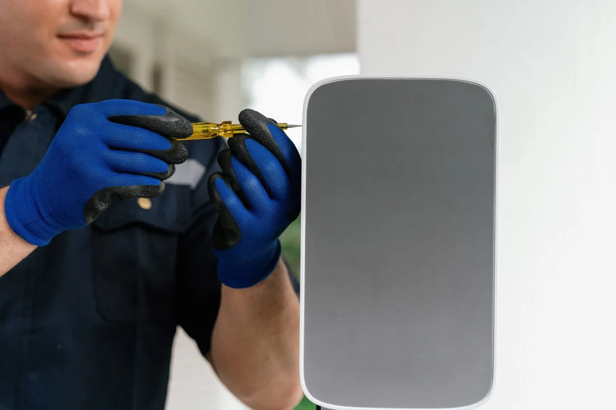 Professional technician installing EV charging station