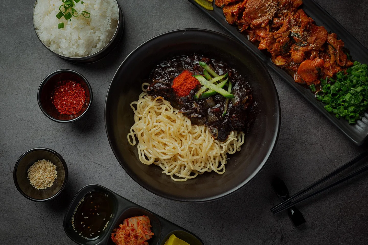 Jjajang-Myeon, featuring sweet and savory black bean sauce over noodles with pork and veggies, at U&I Korean Fusion.