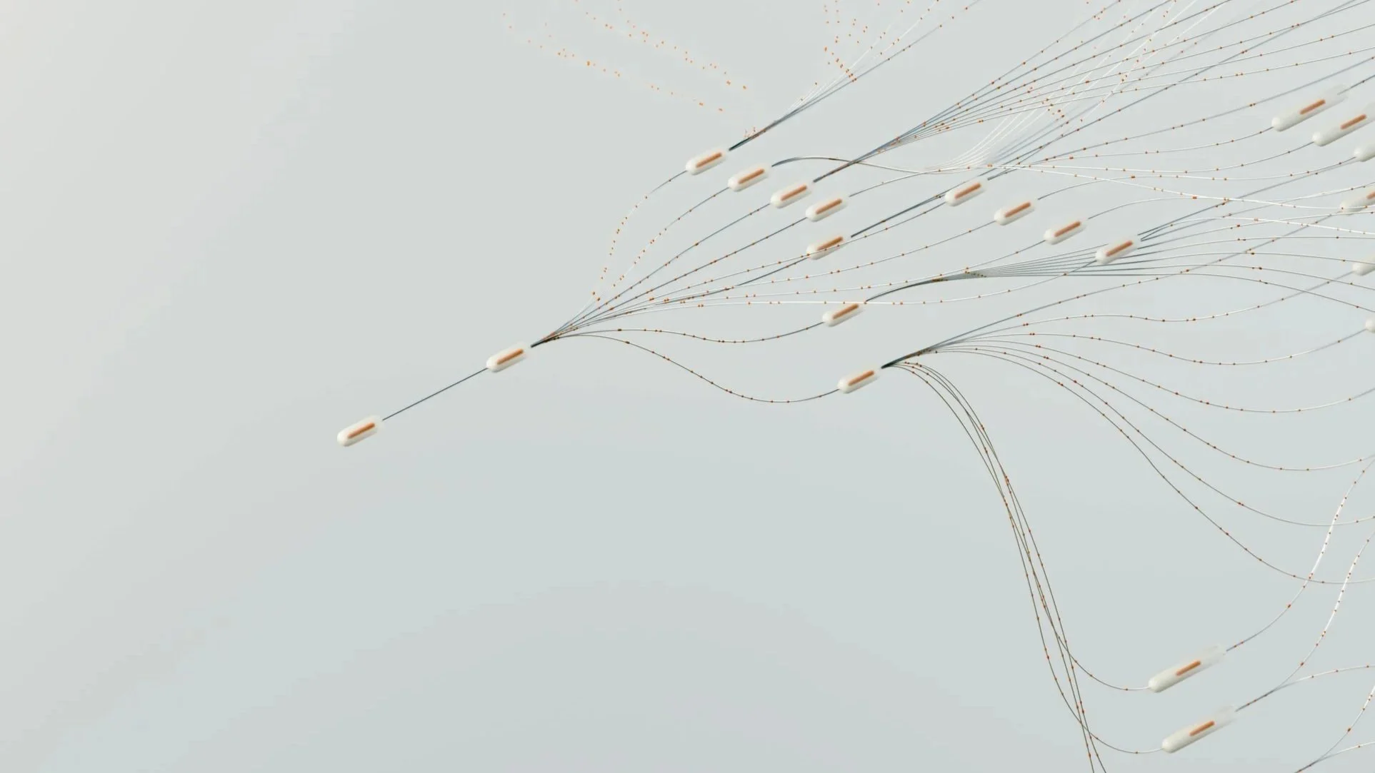 Medical device with multiple wires and white components, possibly a neurostimulation or electrode array.