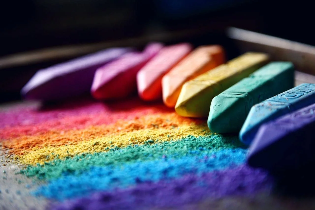 rainbow chalk on a dark background