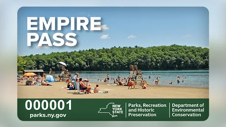 This is an image of a NYS Empire pass. It shows an image of a lake-side beach with a crowd of people enjoying the nice day.