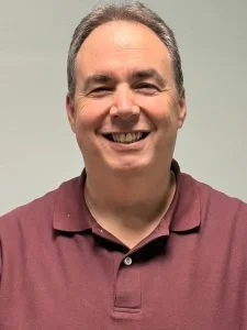 Image of a man looking at the camera and smiling