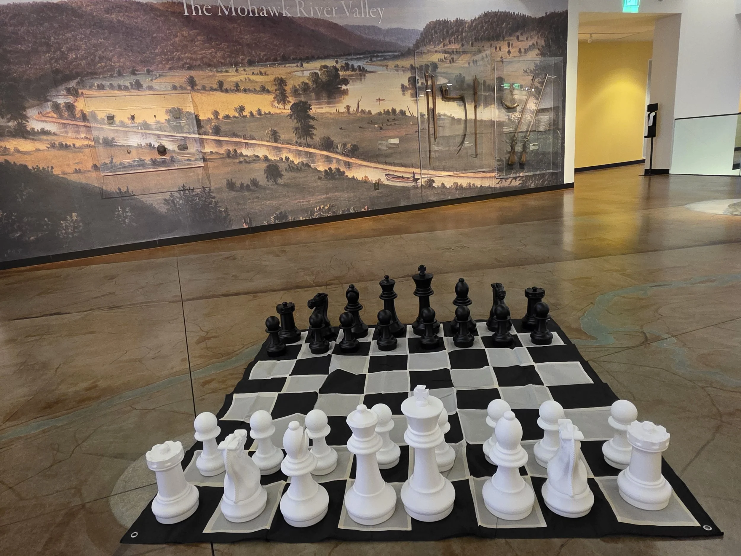 This is an image of the Megachess giant chess set, ready to play, on the floor in our Great hall.