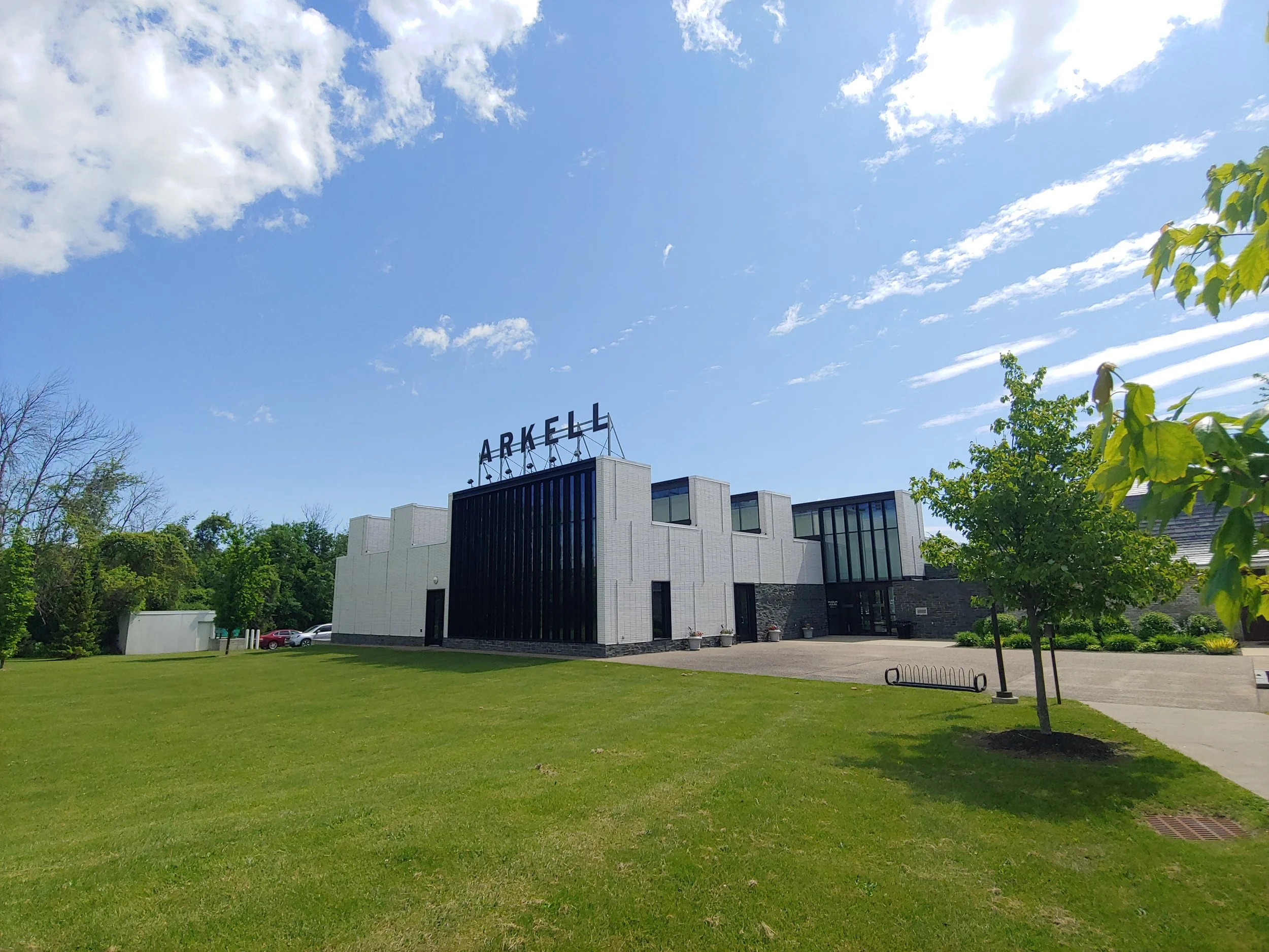 Photo of a large white building with a sign that says "Arkell" on the roof