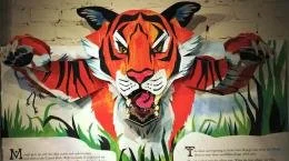 Image of a tiger leaping outward