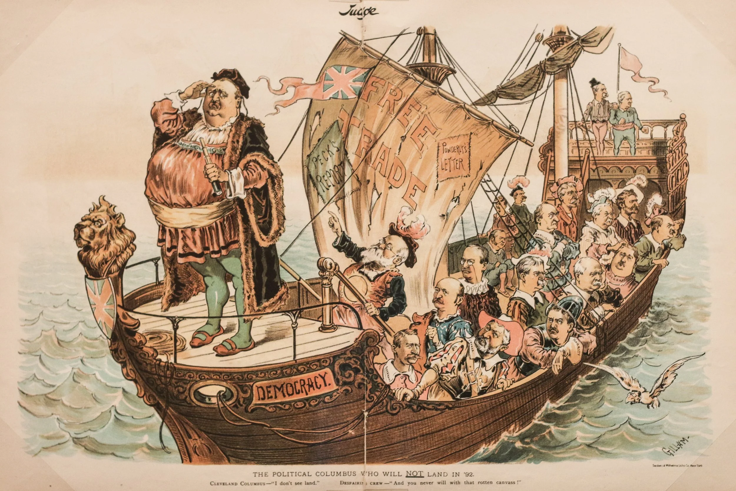 Political cartoon of a large man standing on the bow of a ship. There are people behind him in the boat. The sail says the word "free trade". 