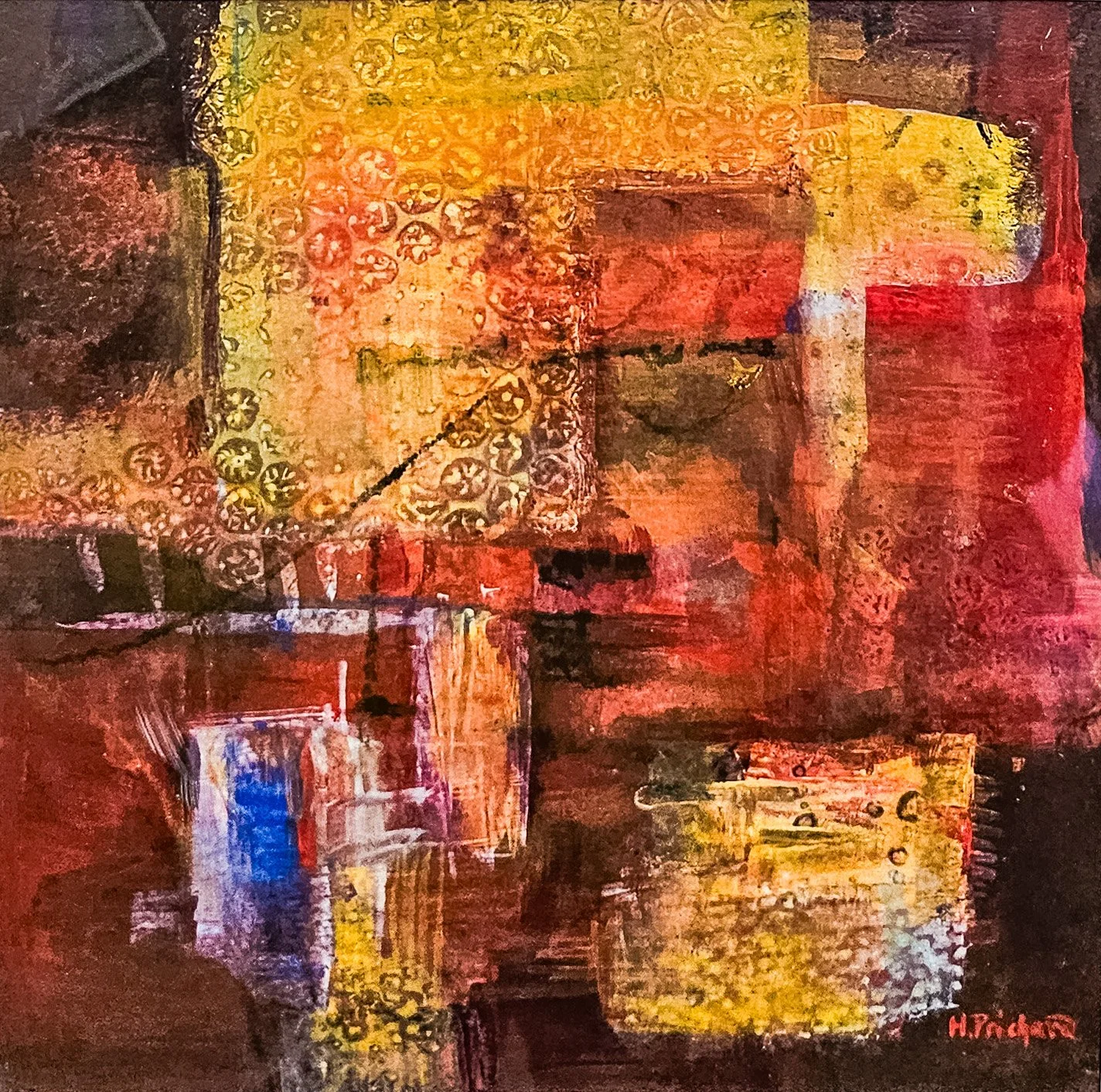 An abstract acrylic painting of large blocks of yellow, red, and rust. There are patterns throughout.