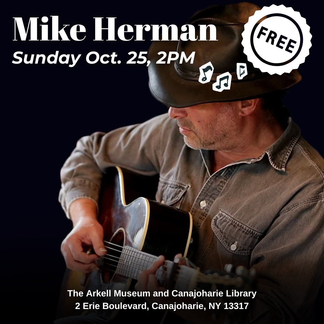 A graphic for the Sunday Concert Series featuring Mike Herman. The photograph is of Mike Herman, an older man who is playing the guitar, with a serious expression shrouded by his hat.