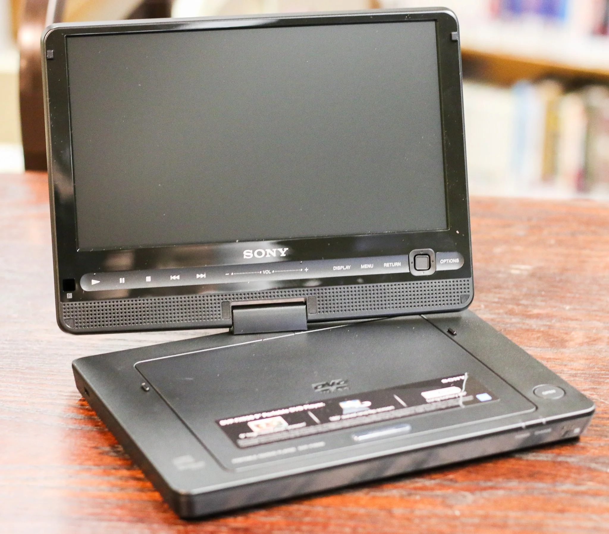 This is an image of a small black portable dvd player