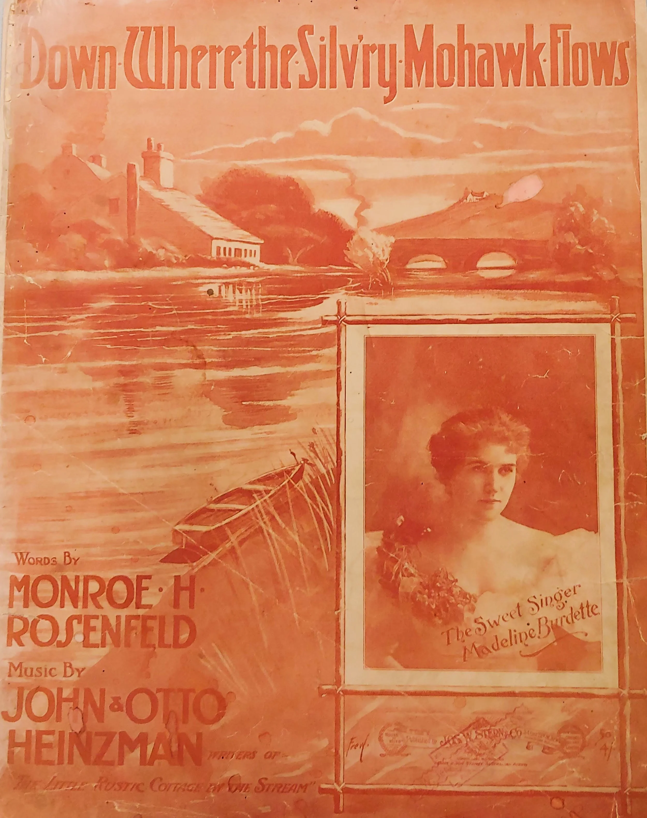 Orange and white printed sheet music with a waterway and a picture of a woman in a fancy dress