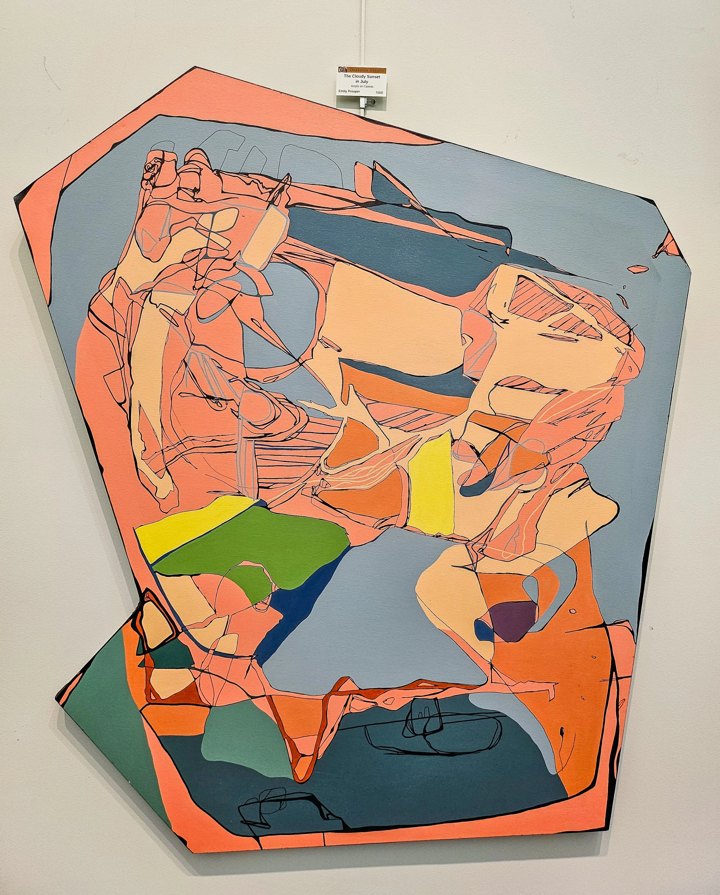 A very large scale abstract acrylic painting on an oddly shaped canvas. It is primarily peach, slate blue, and a lighter peach color, with areas of teal, gren, yellow, and a darker blue. Thin black lines are around and through the shapes.