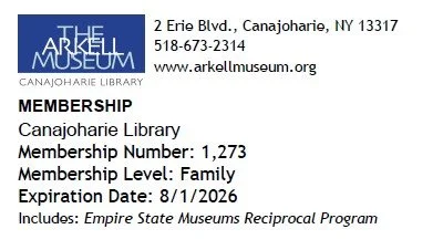 This is a photo of an Arkell Museum pass. It includes the Canajoharie Library pass details and expiration date.
