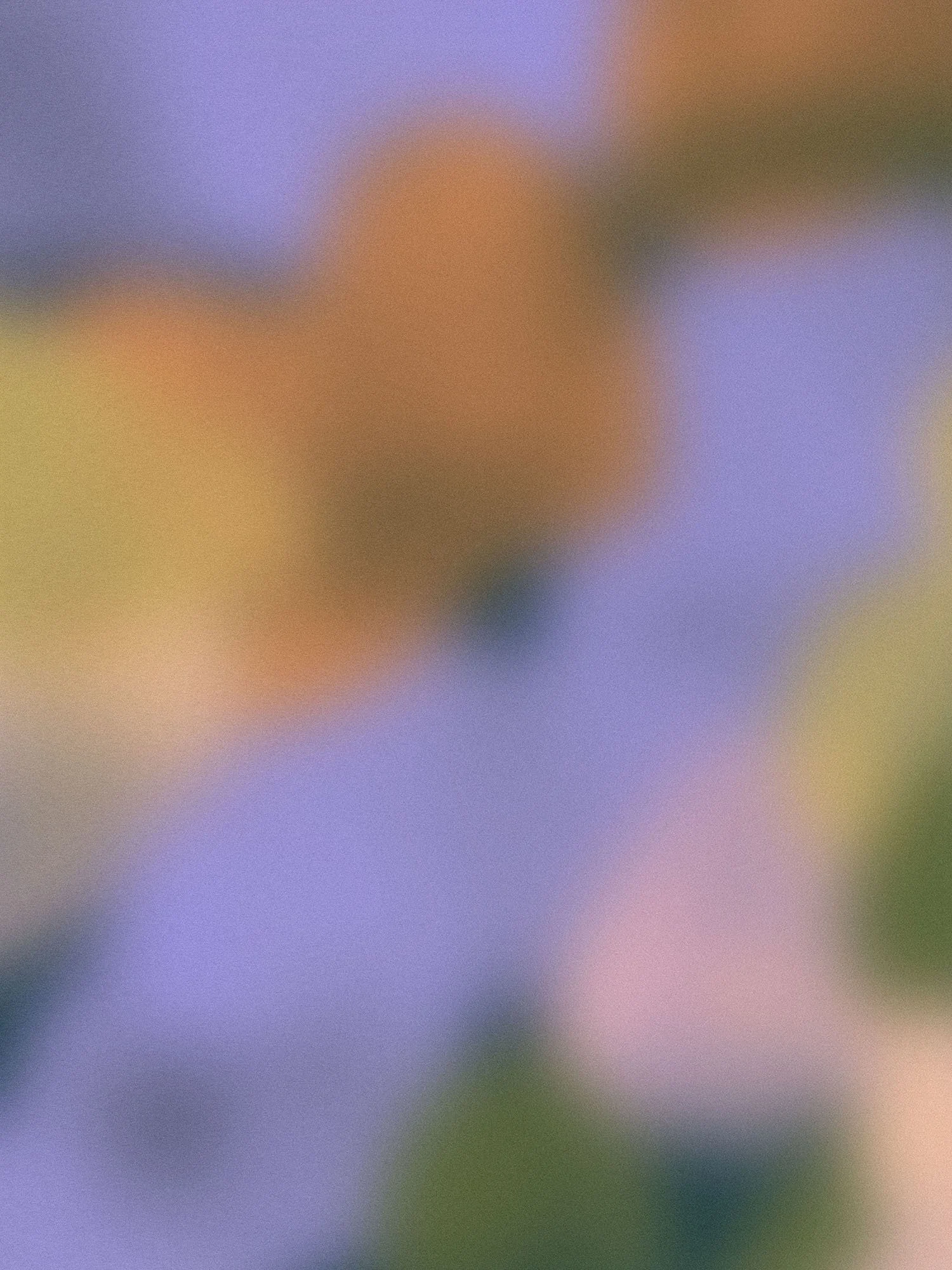 Grainy pastel gradient of lavender, peach, and soft yellow tones creating a calming, atmospheric background.