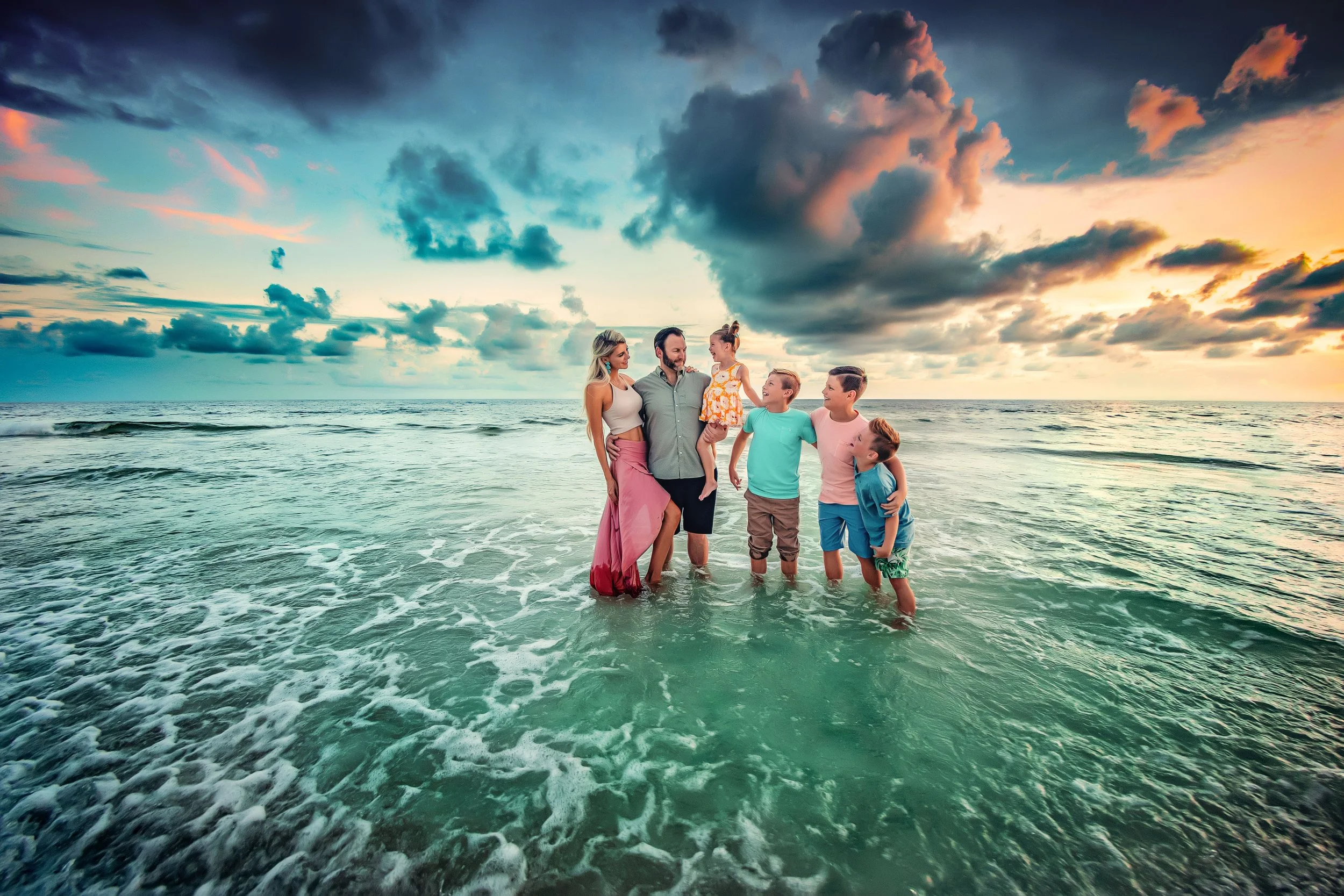 Family of six standing in water during their 30A Family Beach Session with the 30A Family Beach Photographer-Lisa Marie