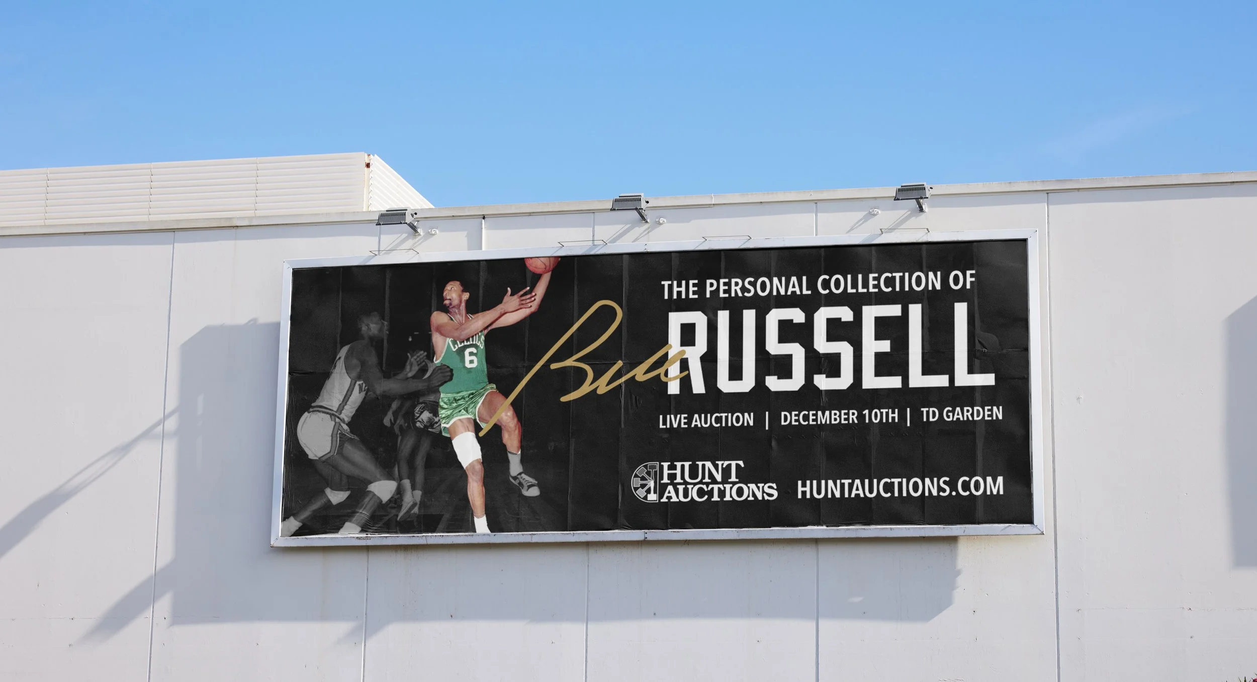 Advertisement banner for a personal collection of Buck Russell, featuring a vintage basketball photo, with details about a live auction on December 10th at TD Garden, hosted by Hunt Auctions.