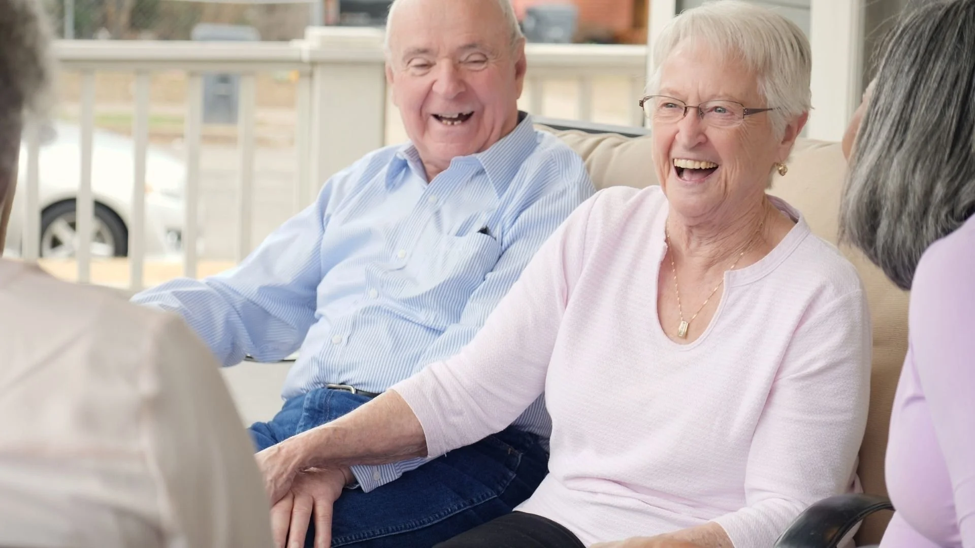 Elderly couple smiling and laughing together