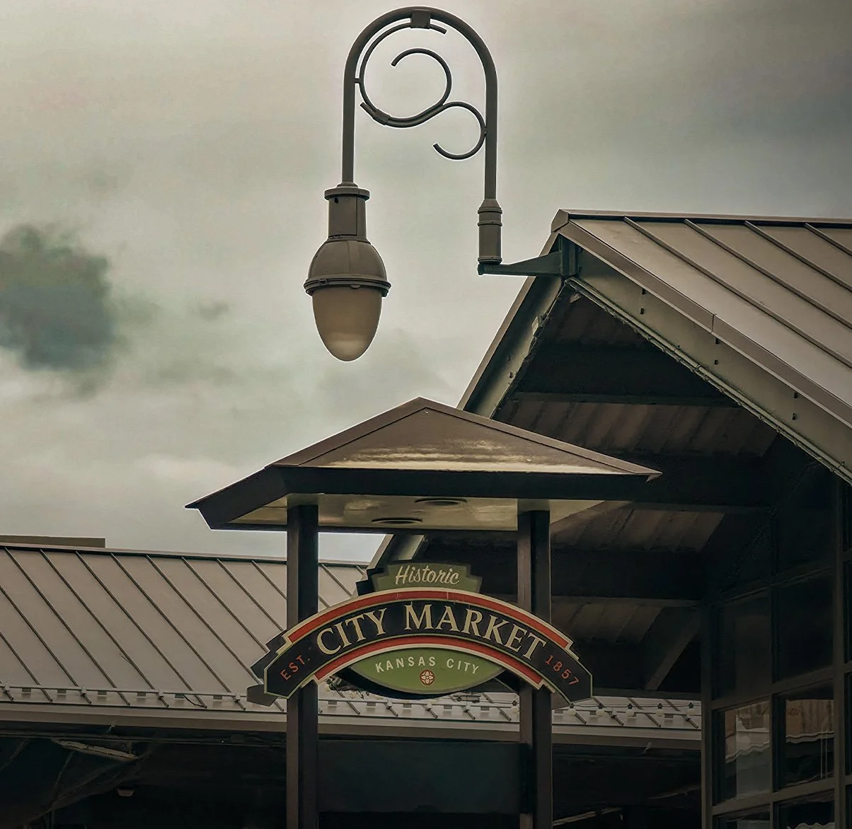 Sign for Historic City Market in Kansas City, with a vintage-style streetlamp above the entrance.