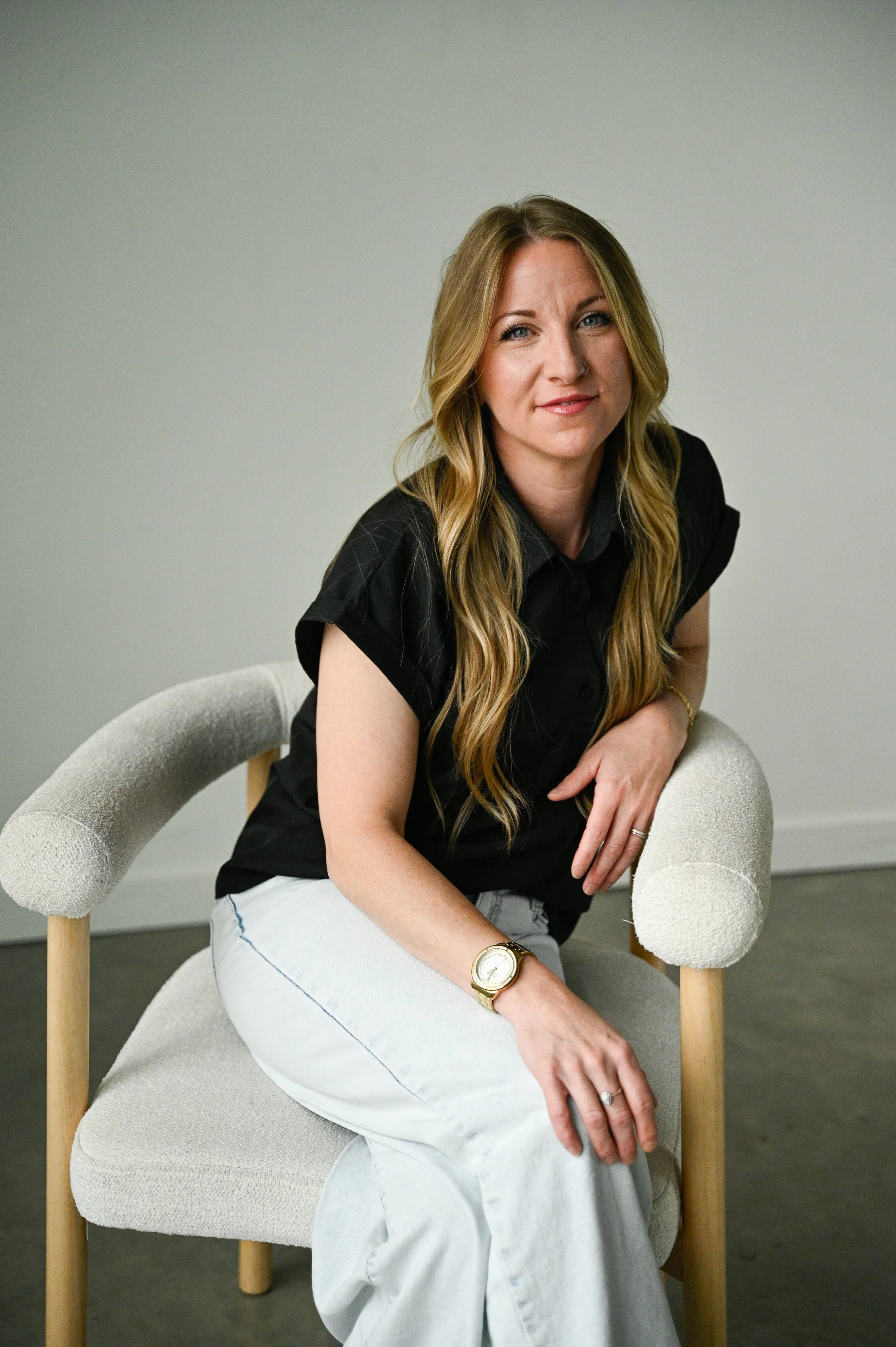 Blonde Hairstylist sitting in a Chair