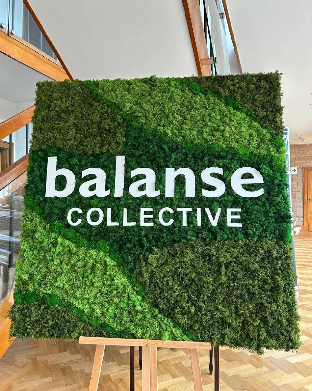 Preserved moss signage created for Balanse Collective, featuring custom logo lettering for a Pilates brand event.