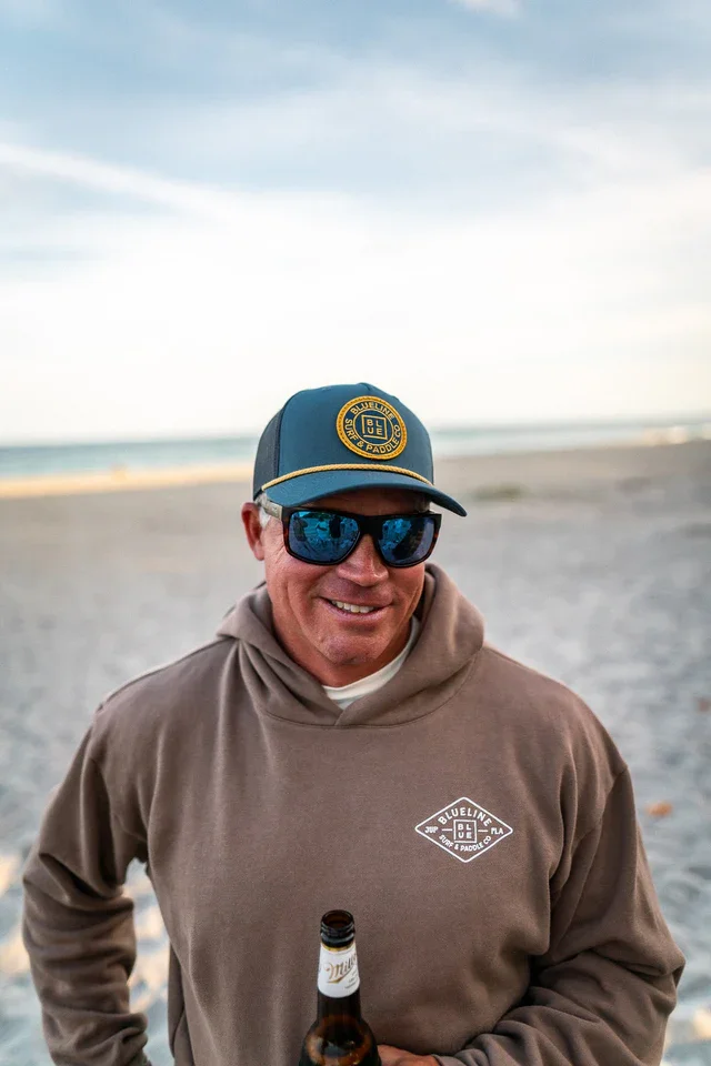 OG_Blueline_pale_indigo_navy_coppertone_hat_beach.webp