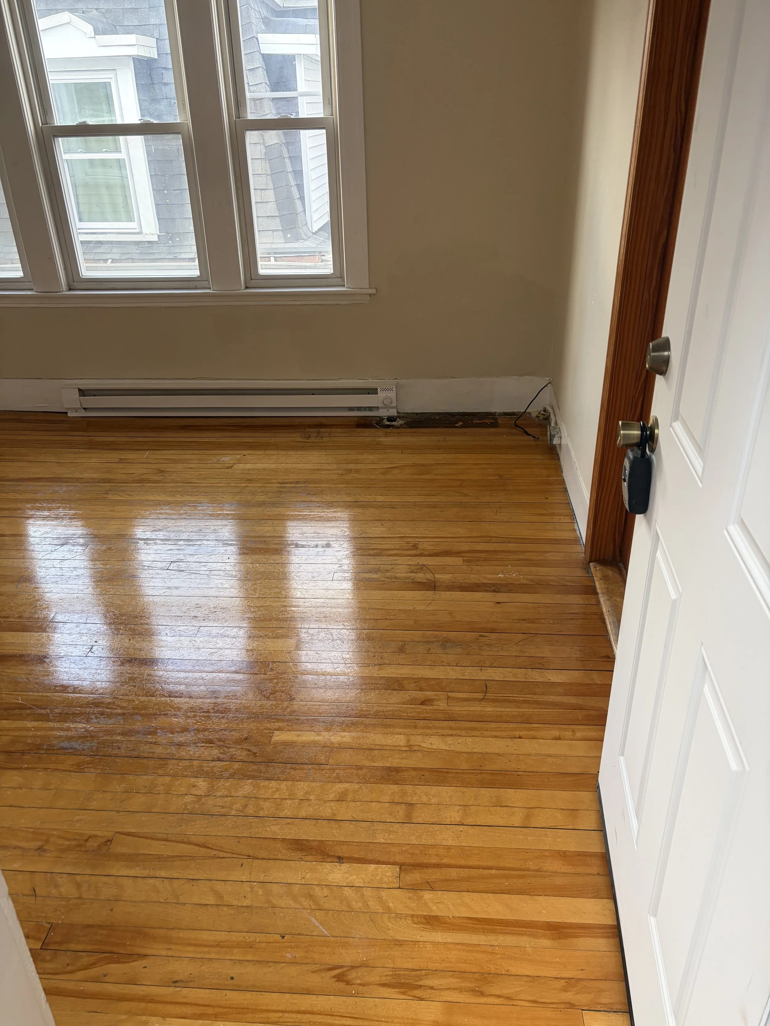 Professional wood floor refinishing contractor restoring hardwood flooring in Worcester MA