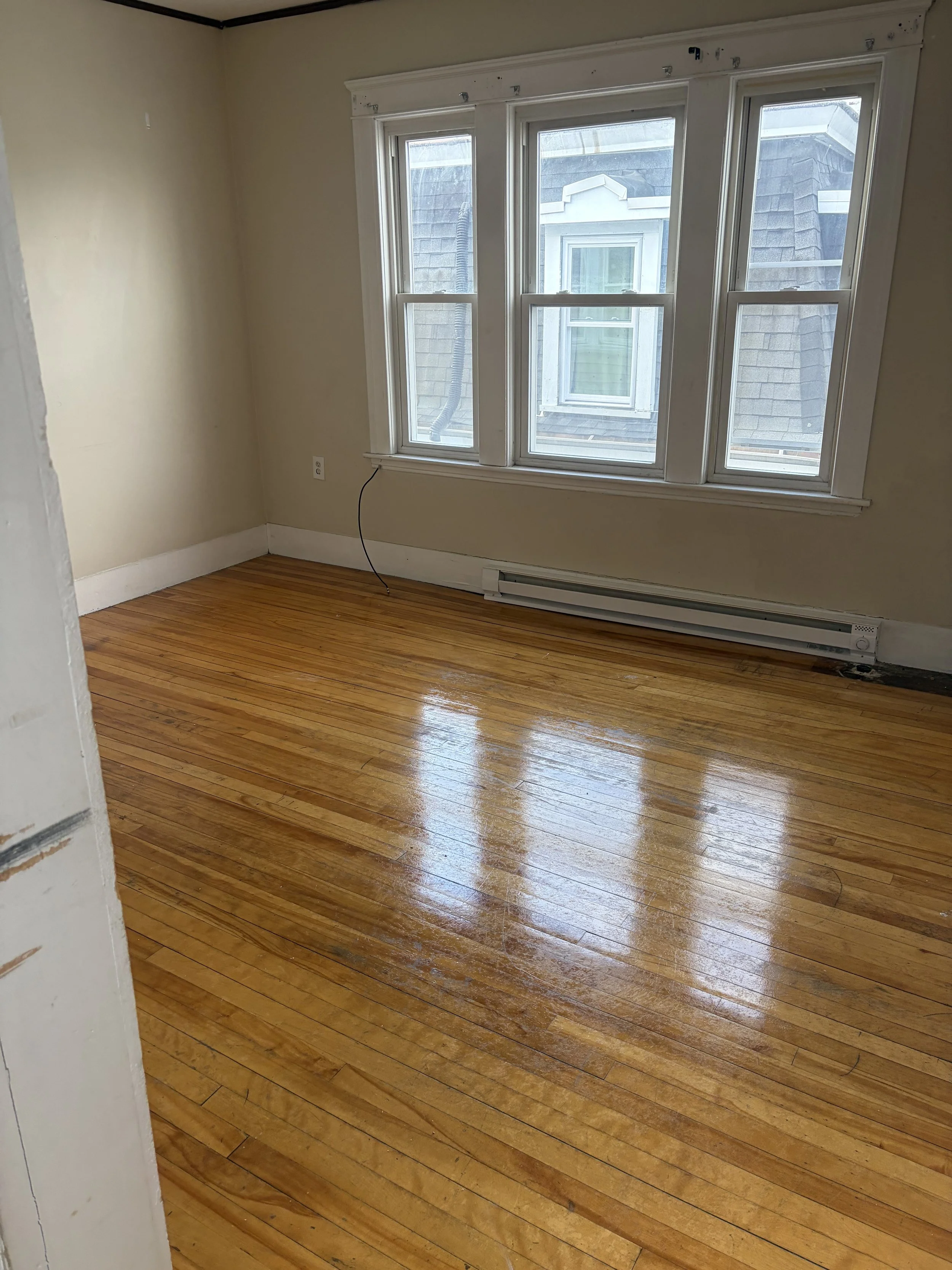 Before and after hardwood floor restoration showing dramatic improvement in wood flooring