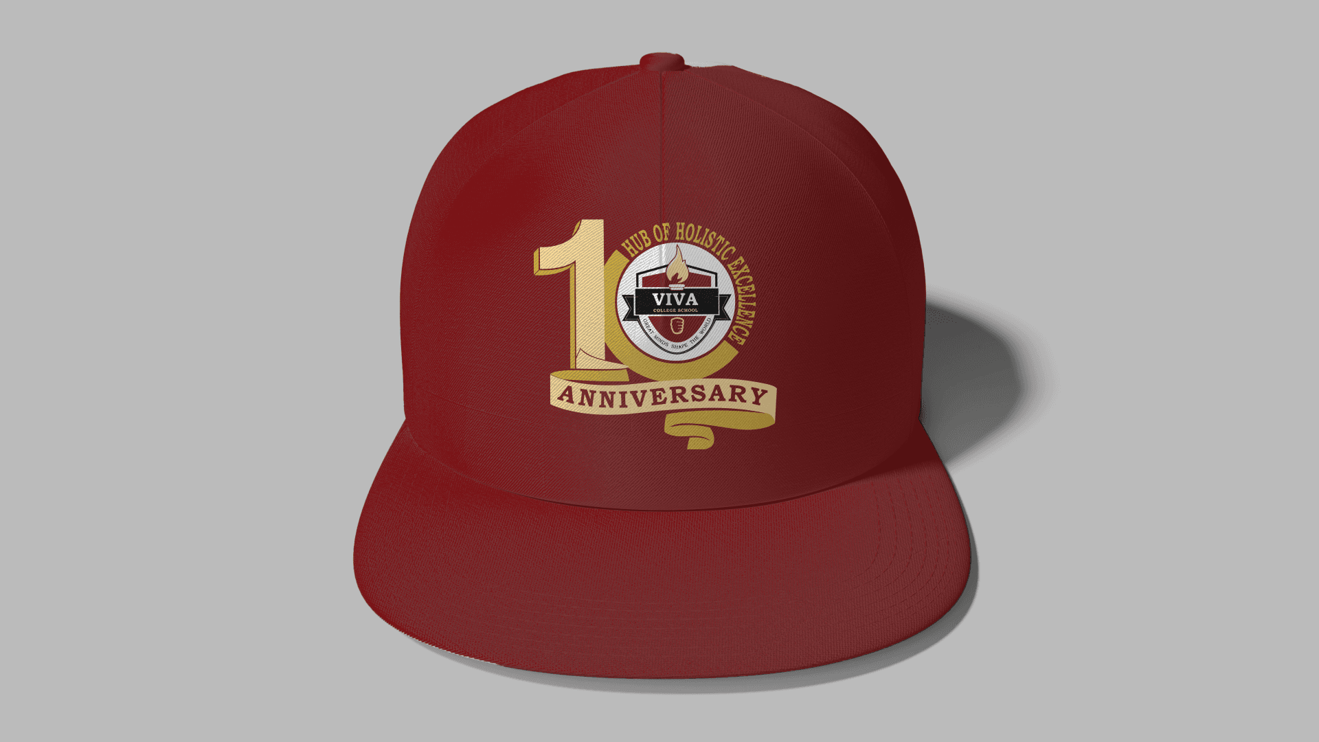 Red baseball cap with a 10th anniversary logo for a college school's holistic counseling hub.