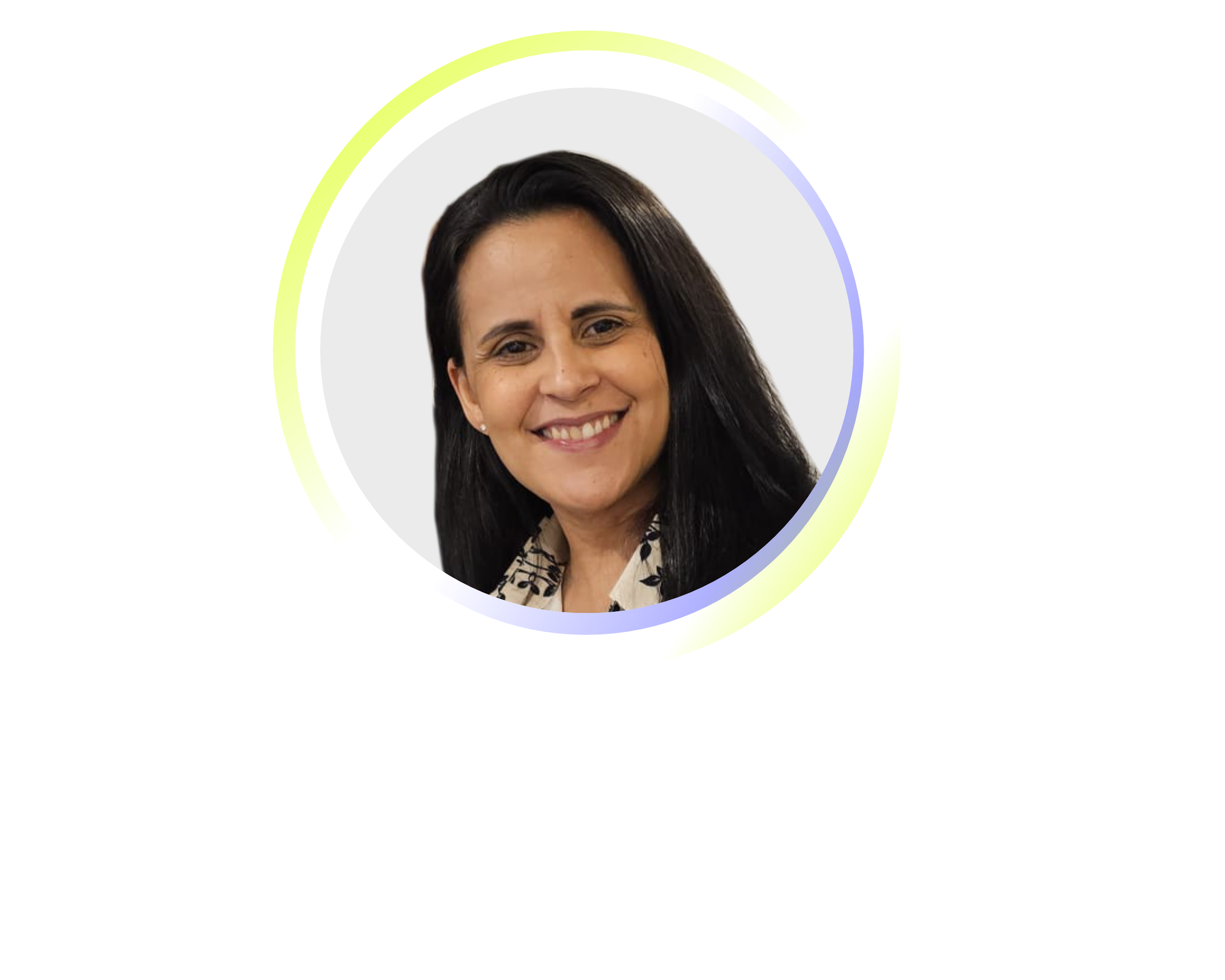 A woman with dark hair, smiling, wearing a black and white patterned blouse.