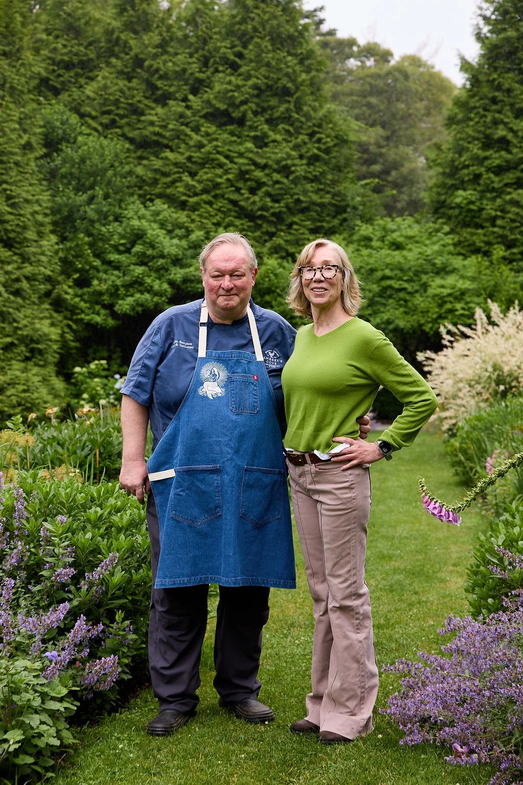 Galen and Bridget Sampson standing in the garden at Lambert's Cove Inn
