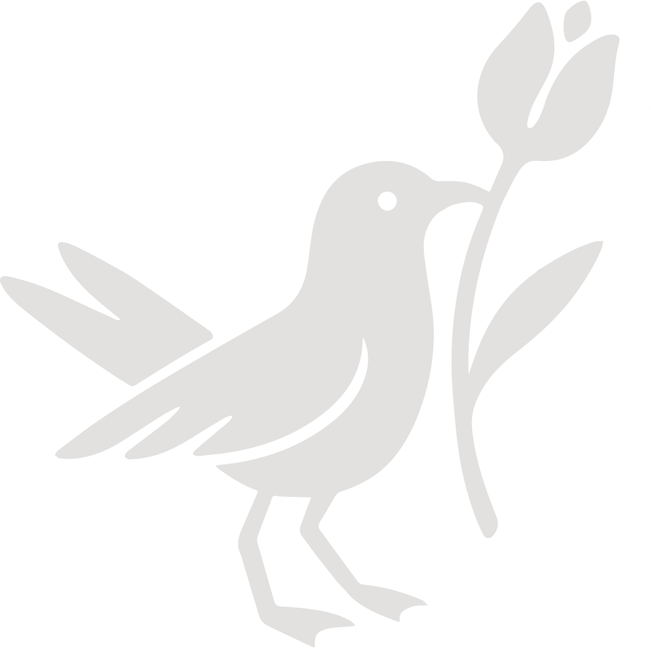 Silhouette of a bird holding a branch with leaves in its beak.